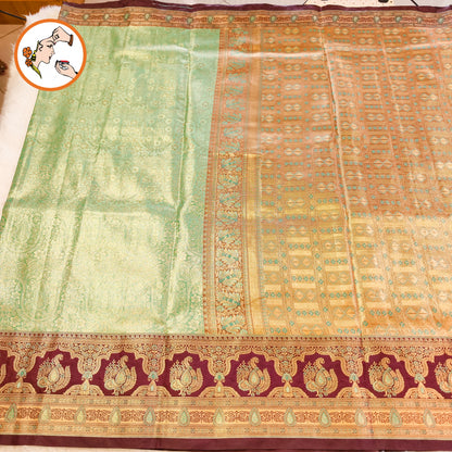 Pista Green with Arakku border Meenakari weaving Kanchipuram High Tissue Silk Saree