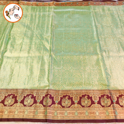 Pista Green with Arakku border Meenakari weaving Kanchipuram High Tissue Silk Saree
