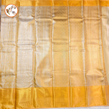 Off White with Gold border Kanchipuram Tissue Silk Saree